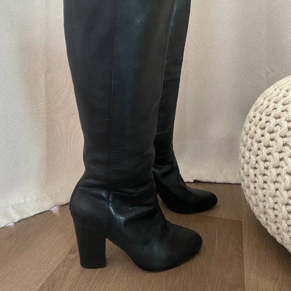 Aldo calf tall boot with open back zipper design. 3 1/2 inch heel.